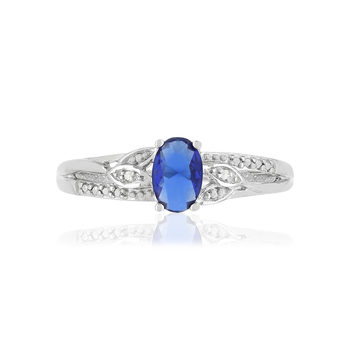 Bague or blanc 375, saphir,diamants.