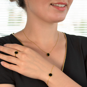 Bague or 750 jaune onyx ovale
