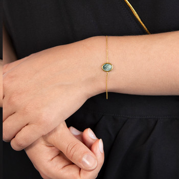 Bracelet or 750 jaune nacre grise ovale 18.5 cm.