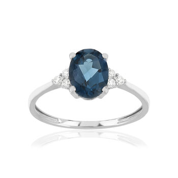 Bague or 375 blanc topaze bleue traitée et zirconias