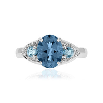 Bague or 375 blanc topazes bleues traitées