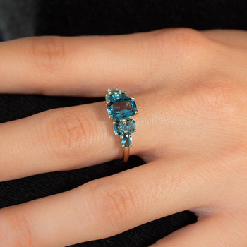Bague or 375 jaune topazes bleues traitées ovales