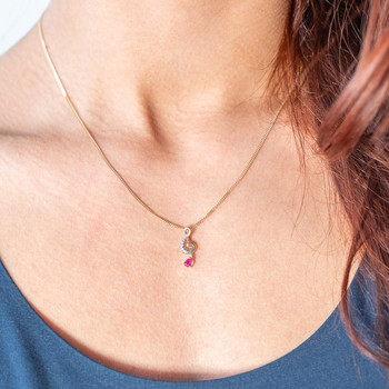 Pendentif or 375 2 tons note de musique diamants et rubis