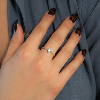 Bague or 375 jaune topaze bleue