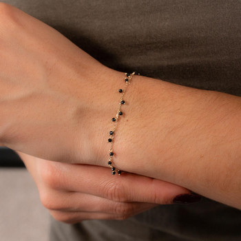 Bracelet or 375 jaune pierres synthétiques noires 19cm