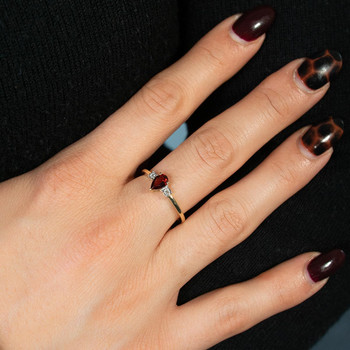 Bague or 750 jaune grenat et diamants