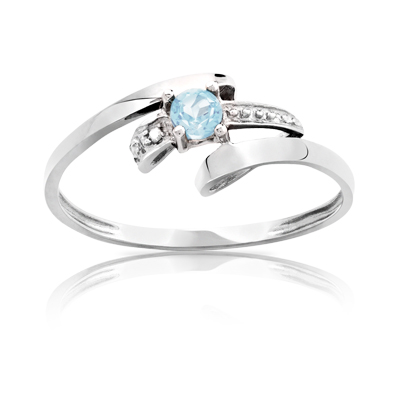 Bague or 750 blanc topaze bleue traitée