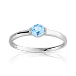 Bague or 375 blanc topaze bleue trait&eacute;e
