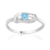Bague or 750 blanc topaze bleue traitée et diamant
