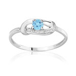 Bague or 750 blanc topaze bleue traitée et diamant