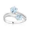 Bague or 750 blanc topaze bleue traitée