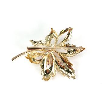 Tweedehands broche in 750 geel goud met synthetische robijnen