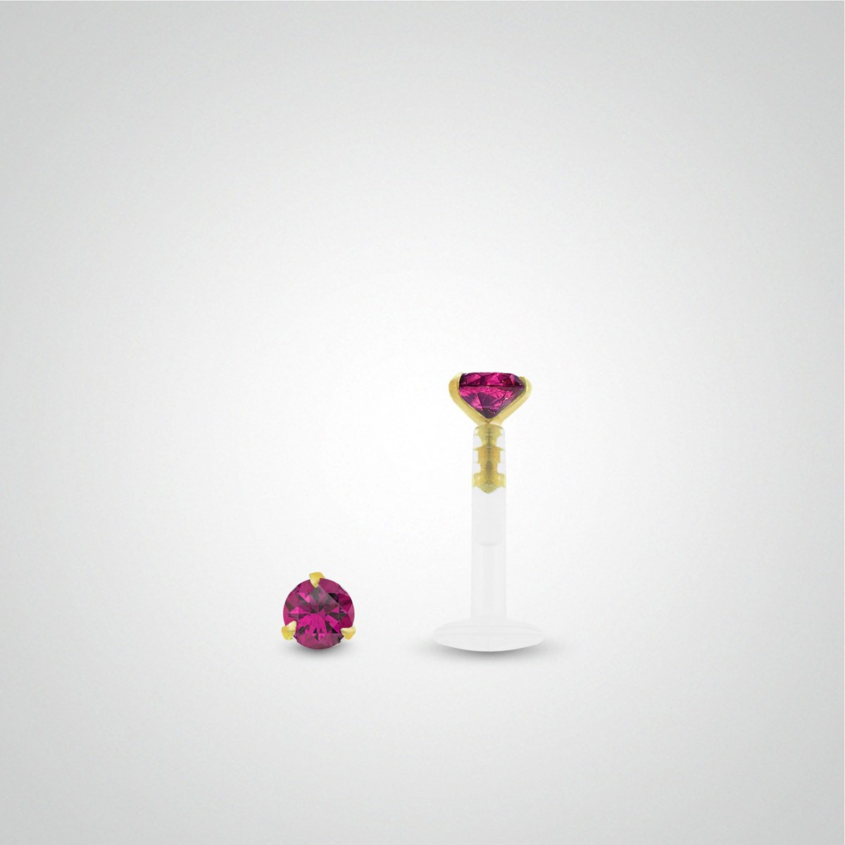 Piercing de lèvre or jaune avec oxyde de zirconium fushia