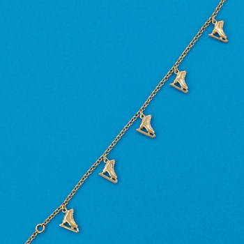 Bracelet patinage cinq breloques - Plaqué or