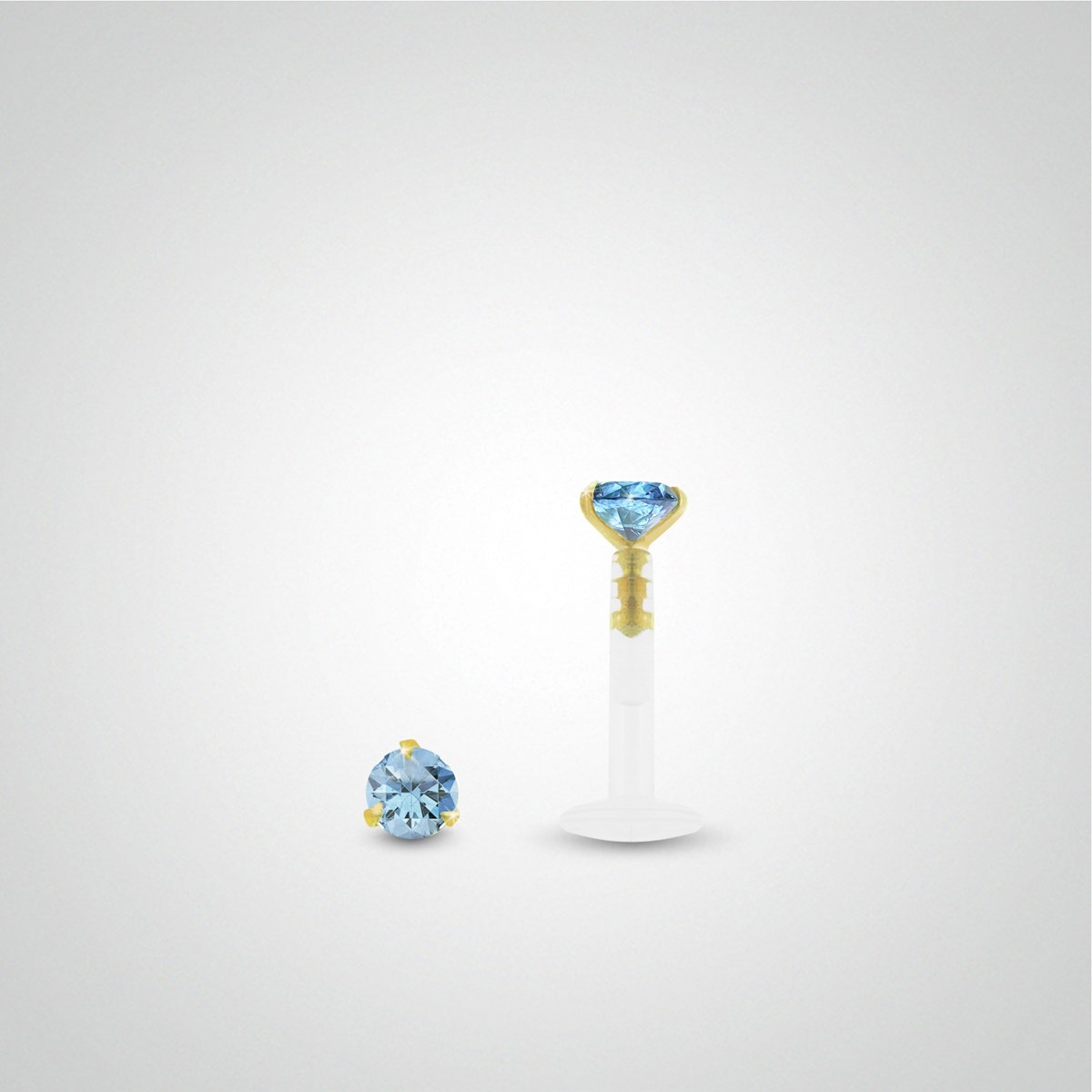 Piercing hélix : or jaune avec oxyde de zirconium bleu clair