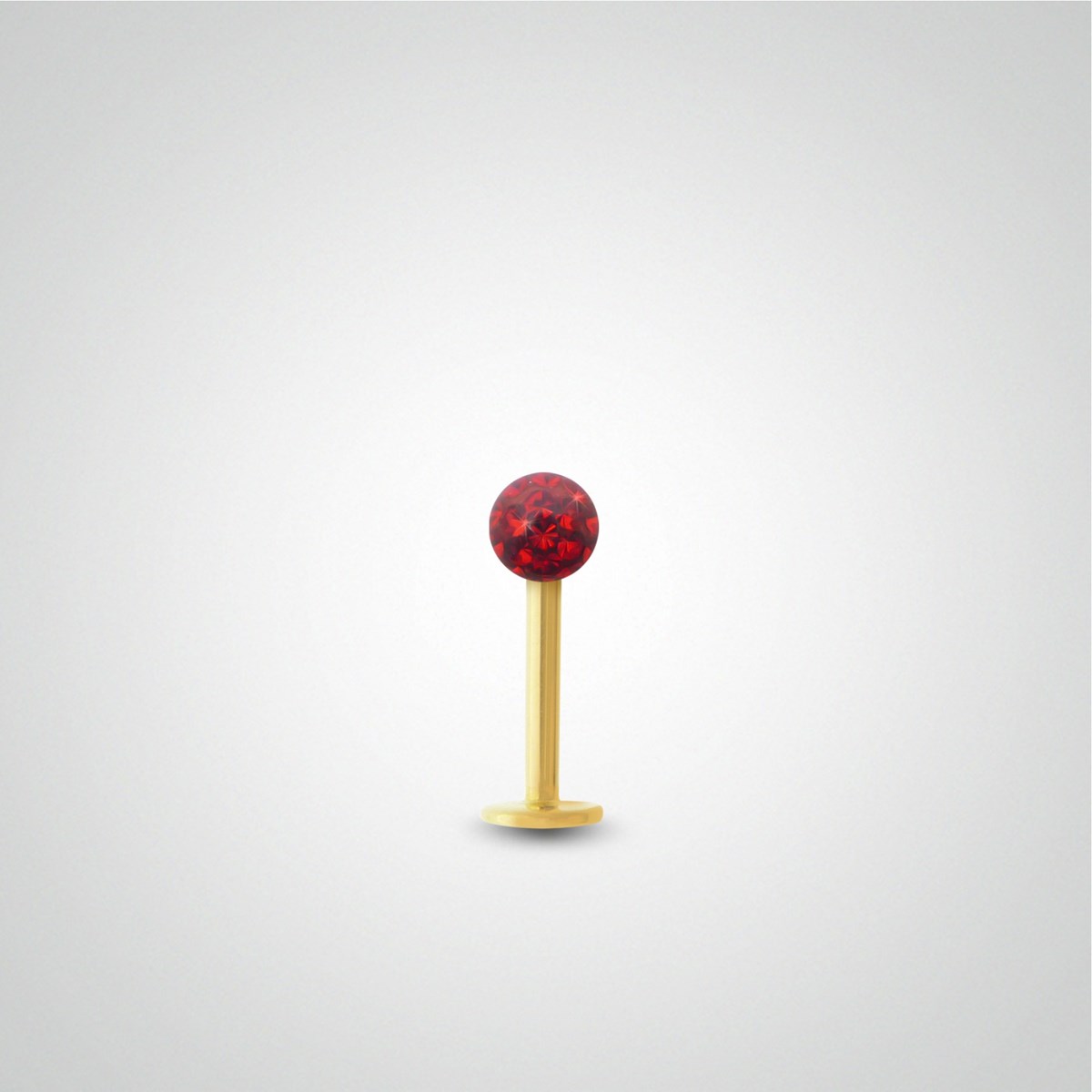 Piercing tragus en or jaune et cristal de Swarovski rouge