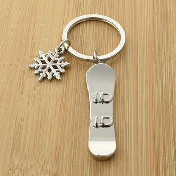 Silver snowboard and snowflake key ring