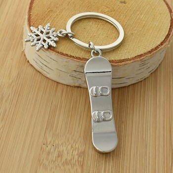 Silver snowboard and snowflake key ring