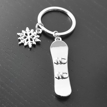 Silver snowboard and snowflake key ring