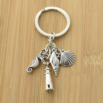 Silver seahorse lighthouse shell keyring