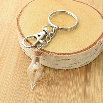 Silver-plated bag jewel key ring with glass bottle and yellow flower