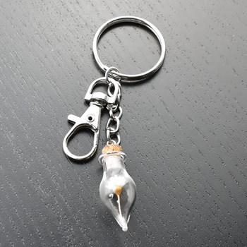 Silver-plated bag jewel key ring with glass bottle and yellow flower