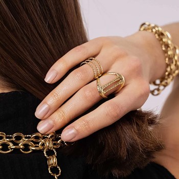 Bague ajustable en acier argenté composée de formes géométriques ajourées et texturées