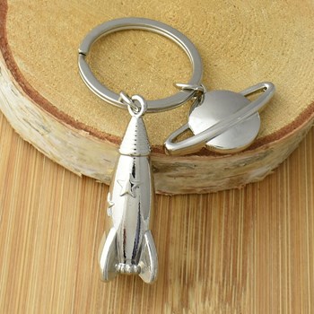 Silver rocket keyring with stars and planet Saturn