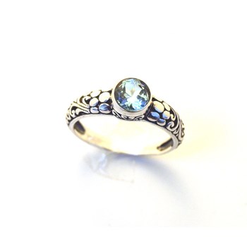 Silver and blue topaz ring