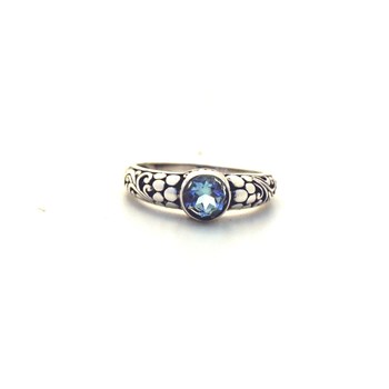 Silver and blue topaz ring