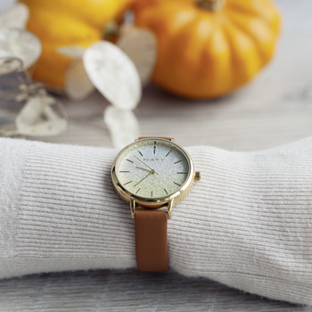 Women's gold watch with brown synthetic bracelet