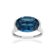 Bague or blanc 750, 1 topaze London Blue traitée de 7,42 carats.