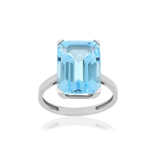 Bague or blanc 750, 1 topaze bleue traitée de 10,50 carats.