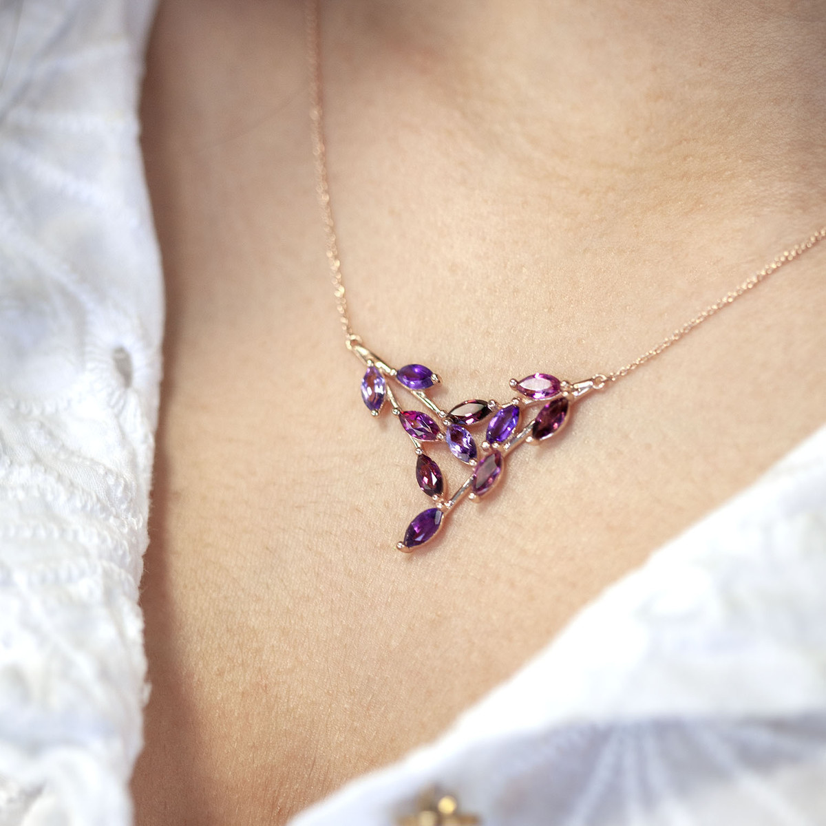 375 rose gold necklace with amethysts, rhodolite garnets, and treated pink topazes, 45 cm - worn view 1