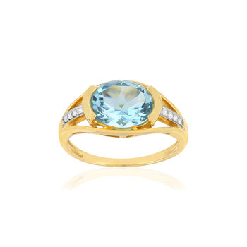 Bague or 375 2 tons, topaze bleue traitée, diamants.