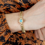 Bracelet rigide acier jaune turquoise soleil 60 mm - vue porté 1