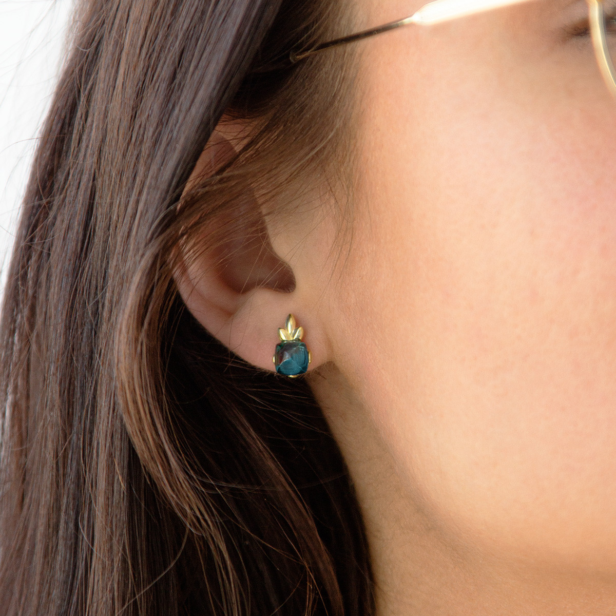 Earrings in gold 375 yellow treated blue topaz - view worn 1