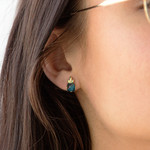 Earrings in gold 375 yellow treated blue topaz - view worn 1
