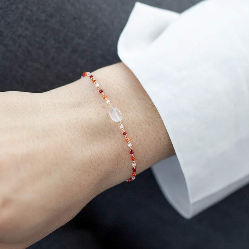 Yellow gold-plated bracelet with rose quartz seed beads, 18 cm - worn view 1