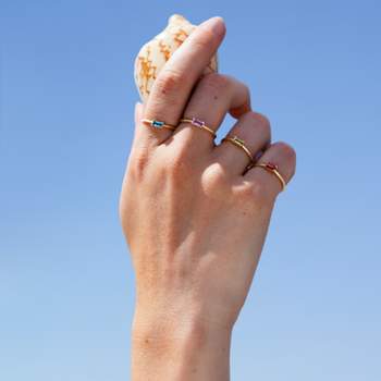Bague or 375 jaune topaze bleue traitée