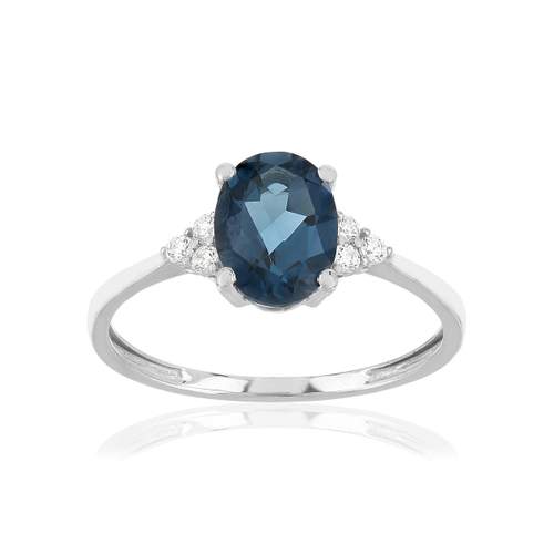 Bague or 375 blanc topaze bleue traitée et zirconias