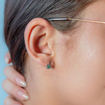 Emerald and diamond heart earrings in 375 yellow gold - view worn 1