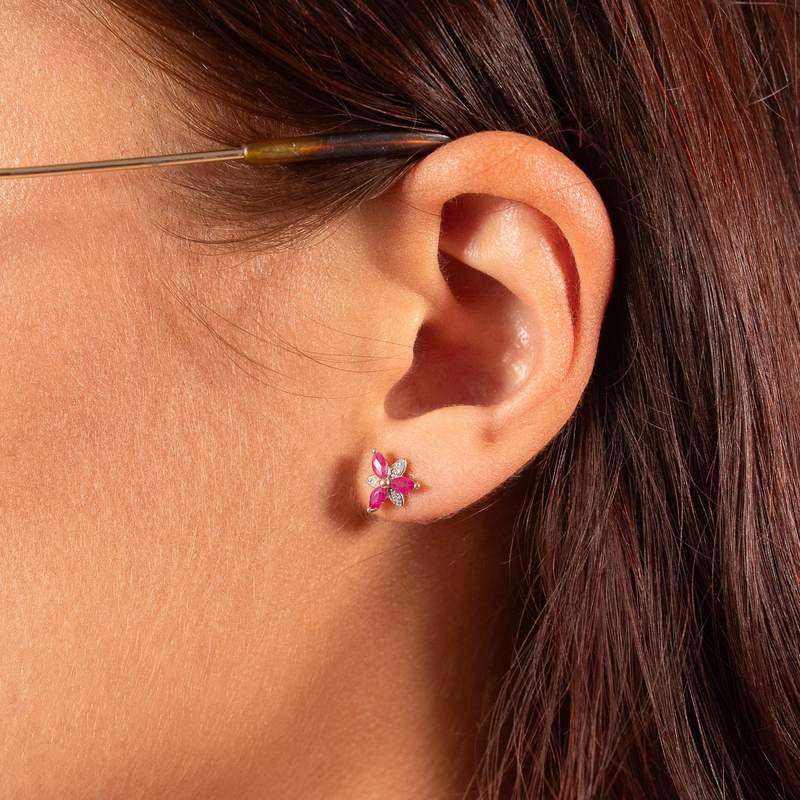 Gold earrings 375 2tons ruby flower and diamonds - view worn 1