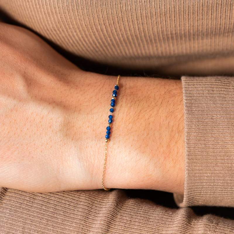 Bracelet or 375 jaune pierres synthétiques bleues 19cm - vue porté 1
