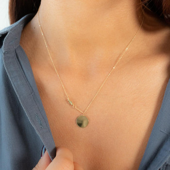 Collier or 375 jaune pierres synthétiques vertes 45cm