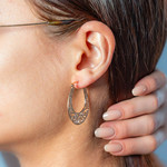 Gold-plated hoop earrings - view worn 1