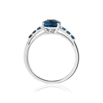 Bague or 375 blanc topazes bleues traitées
