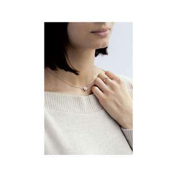 Vergulde ring met twee kleuren en verstrengelde hartjes met zirkonia's