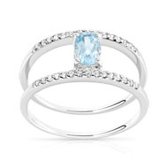 Bague or 375 blanc topaze bleue traitée et diamant
