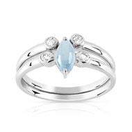 Bague or 375 blanc topaze bleue traitée et zirconia